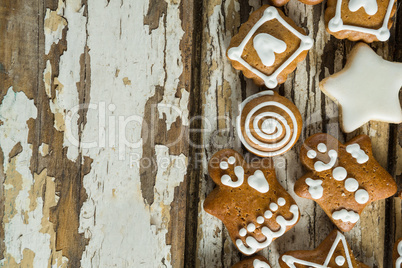 Gingerbread cookies arranged on wooden plank