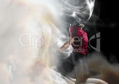 American football player cheering in smoke