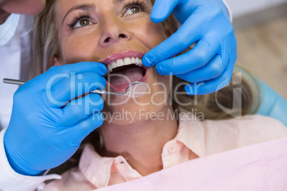 Dentist treating patient at medical clinic