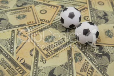 Footballs on a currency notes