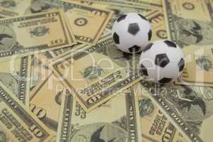 Footballs on a currency notes