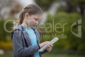 Young girl using digital tablet
