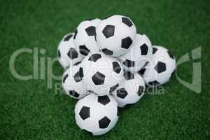 Stack of piled up football soccer balls