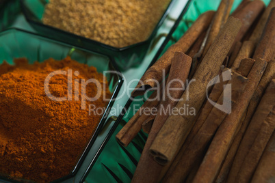 Cinnamon with spices powder in bowl