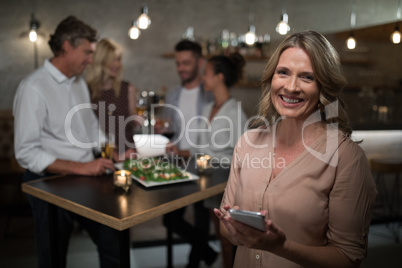 Portrait of woman using mobile phone