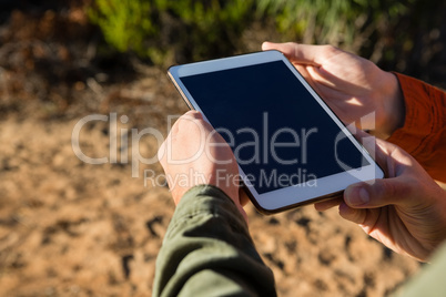 Cropped hands of couple digital tablet