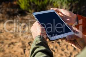 Cropped hands of couple digital tablet