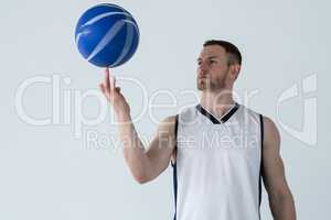 Player spinning basketball on finger