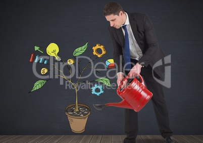 Man holding watering can and Drawing of Business graphics on plant branches on wall