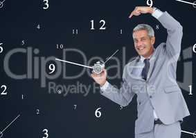 Business man holding a clock against background with clocks