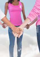 Breast cancer women  putting hands together  with sky clouds background