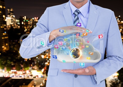 businessman with cloud between his hands and earth on cloud and applications icons coming up from it