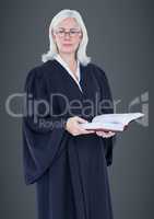 Female judge with gavel against grey background