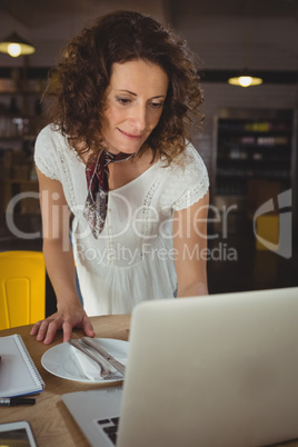 Businesswoman using laptop