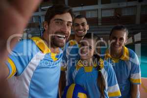 Portrait of happy volleyball players