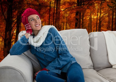 Woman in Autumn with hat and scarf in forest