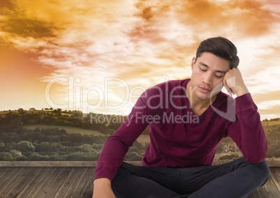 Man meditating over landscape
