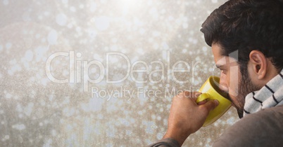 Man drinking from cup with sparkles