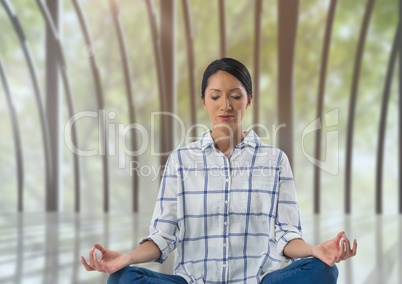 Woman meditating in meditation room