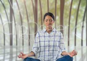Woman meditating in meditation room