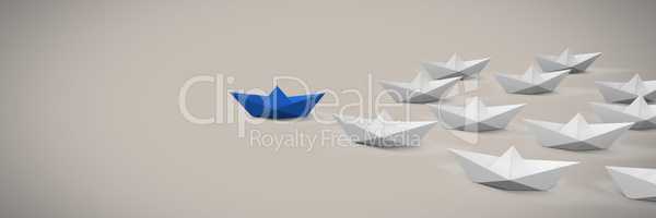 Group of Paper boats on soft pink background
