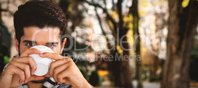 Composite image of portrait of man having a cup of tea
