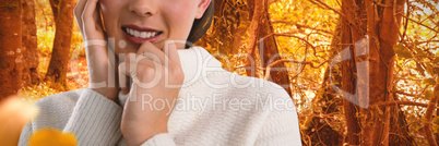 Composite image of portrait of smiling young woman wearing sweater