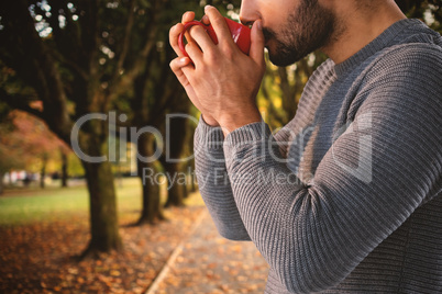 Composite image of side view of thoughtful man having coffee