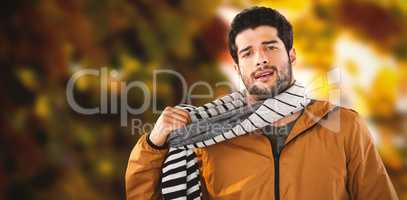 Composite image of portrait of young man wearing scarf posing against white background