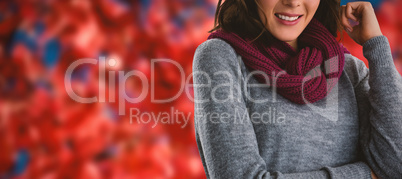 Composite image of portrait of young woman in hat and scarf