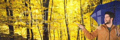 Composite image of young man with blue umbrella gesturing