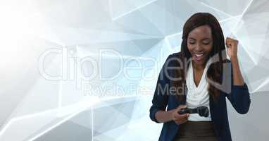 Businesswoman playing with computer game controller with polygon background