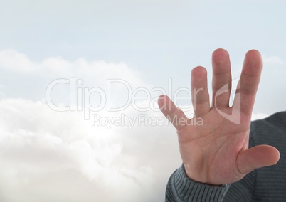 Hand open with bright clouds background