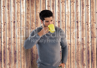 Man against wood with cup