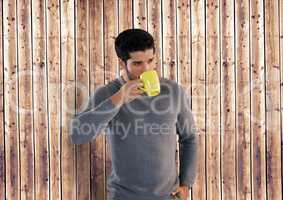 Man against wood with cup