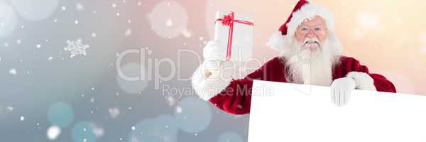 Santa with white card and gift