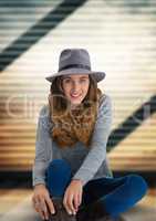 Woman in hat and scarf with soft ridged background