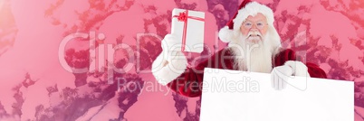 Santa Claus in Winter with gift and white card
