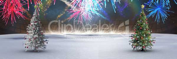 Christmas trees in winter landscape with fireworks