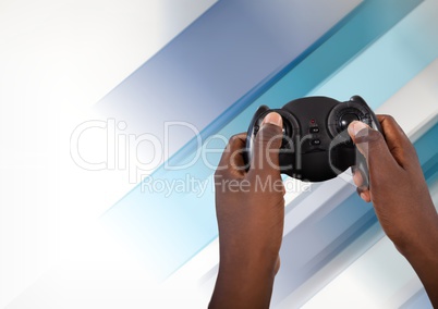 Hands playing with computer game controller with fading background