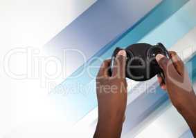 Hands playing with computer game controller with fading background