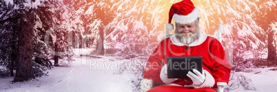 Santa with Winter landscape using tablet