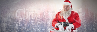 Santa Claus in Winter typing on laptop