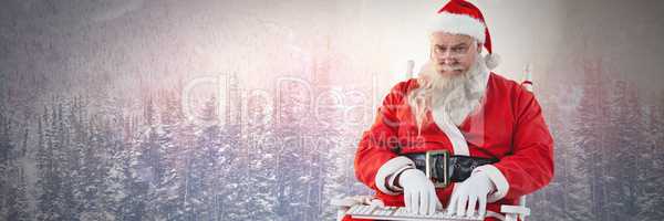 Santa Claus in Winter typing on laptop