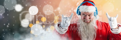 Santa with Winter landscape wearing DJ party headphones