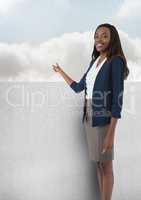 Businesswoman pointing to clouds
