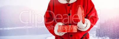 Santa with Winter landscape holding gift