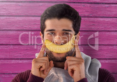 Man against wood with banana smile and scarf