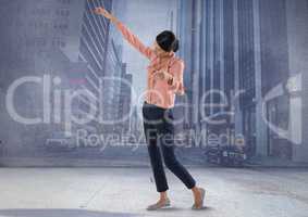 woman posing with arms in city room