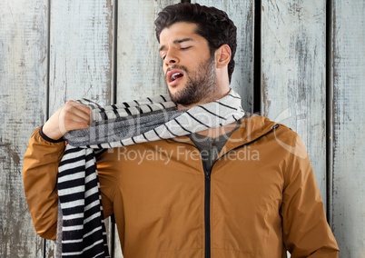 Man against wood with warm scarf